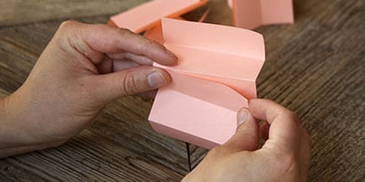 For this activity, see how high you can stack Post-it® Notes to support the weight of a small toy car