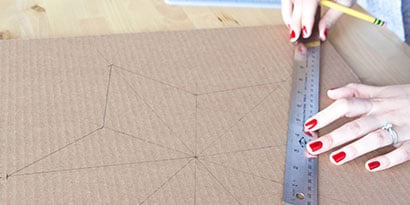 Draw a star and trace it onto the cardboard