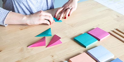 Take one Post-it® Super Sticky Note and fold it in half diagonally so it makes a triangle