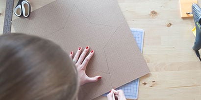 Use the utility knife and cut your star out from the cardboard